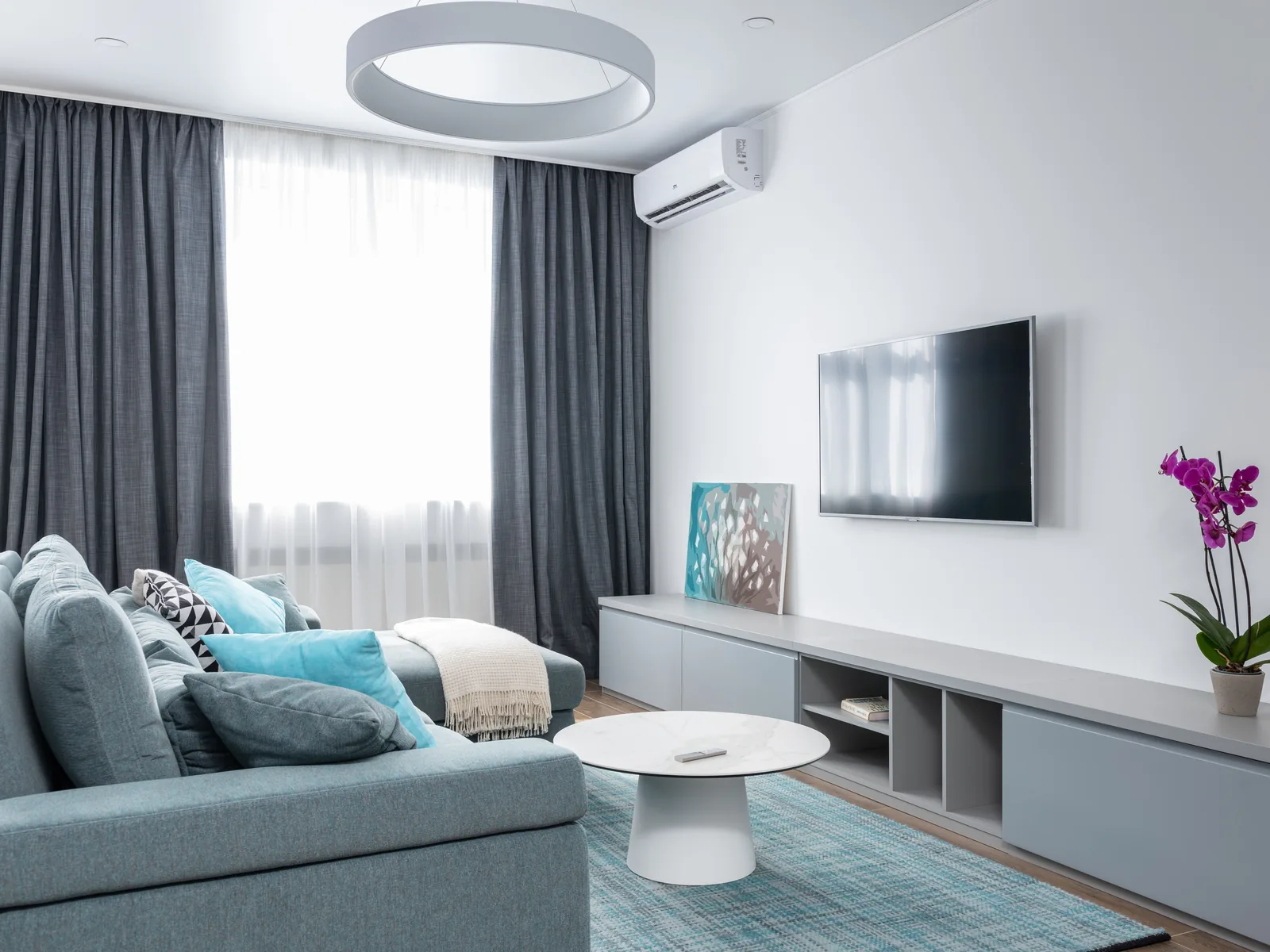 Living room with wall-mounted mini-split air conditioner